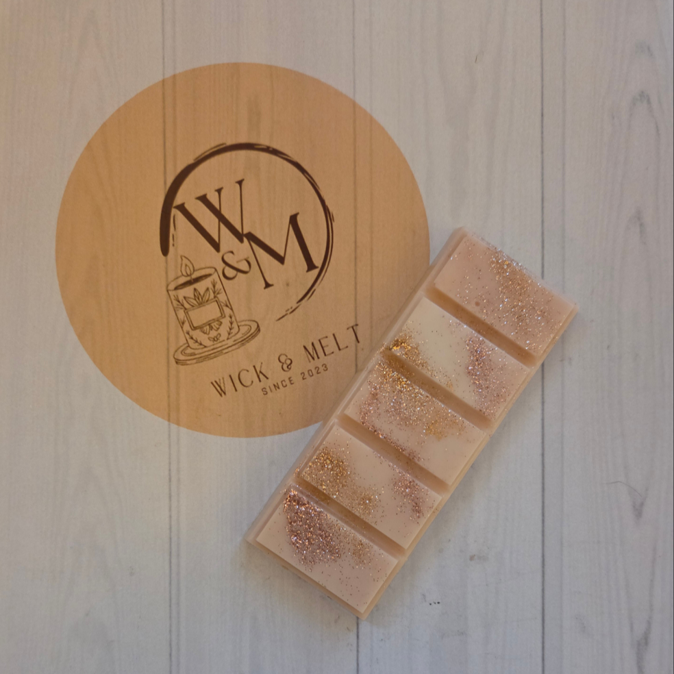 Wick & Melt wax melts with logo on a wooden background