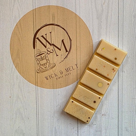 gold wax melt on a logo'd background